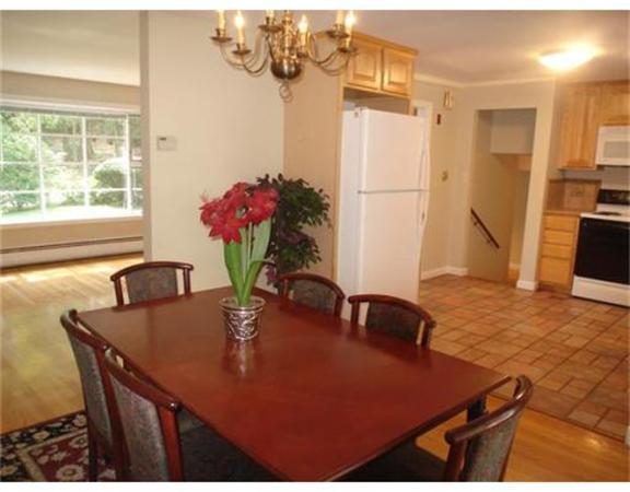 65 Follen Road Lexington, MA 02420 - Photo 4 of 23 a view of a dining room with furniture and a chandelier