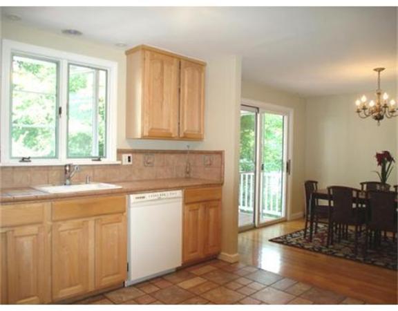 65 Follen Road Lexington, MA 02420 - Photo 6 of 23 a kitchen with sink cabinets and dining table