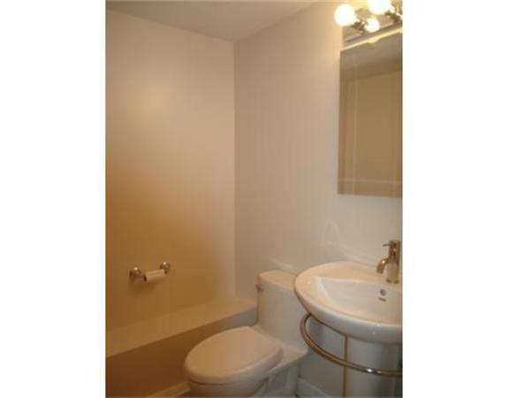 65 Follen Road Lexington, MA 02420 - Photo 8 of 23 a bathroom with a toilet a sink and mirror