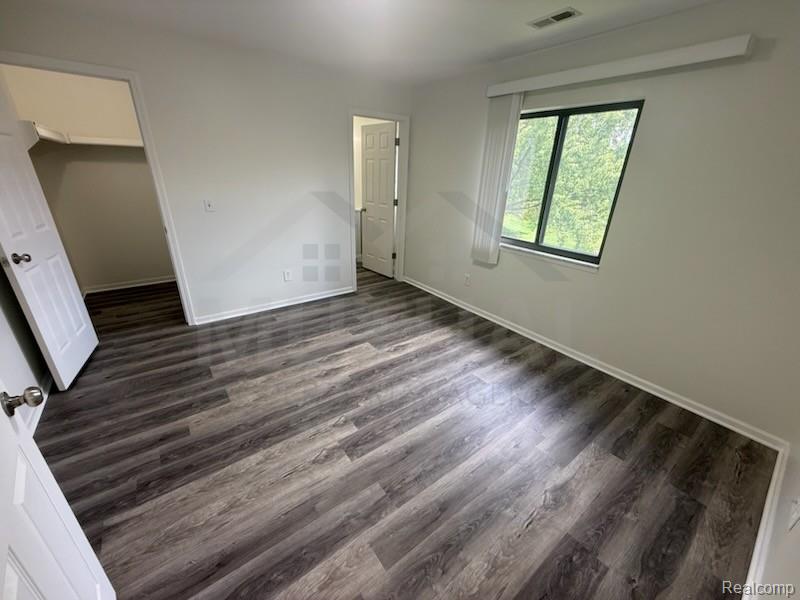 1560 Meadowside Drive Rochester, MI 48307 - Photo 9 of 17 Wood-finish flooring with white trim