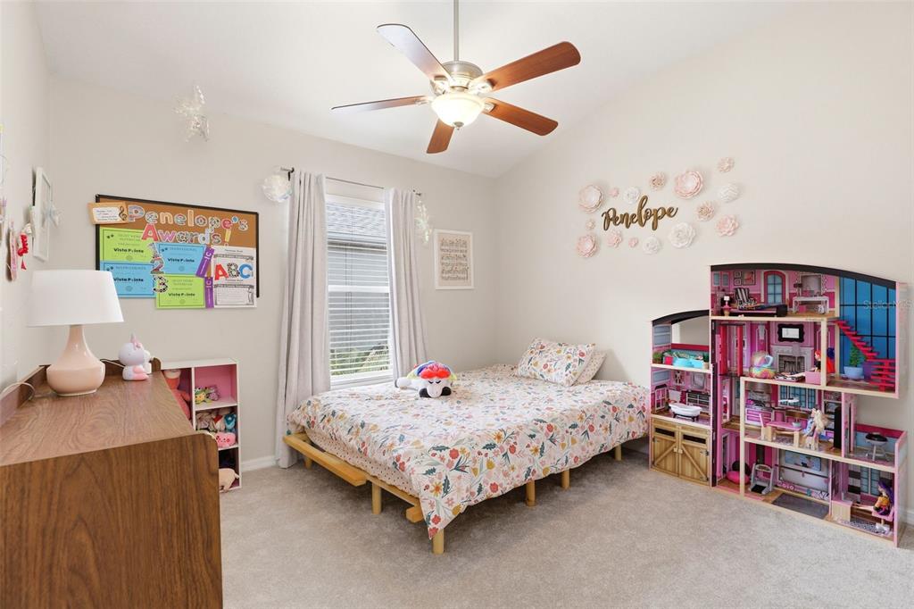6458 South Goldenrod Road, Unit 29B Orlando, FL 32822 - Photo 25 of 40 a bedroom with a bed and a bookshelf