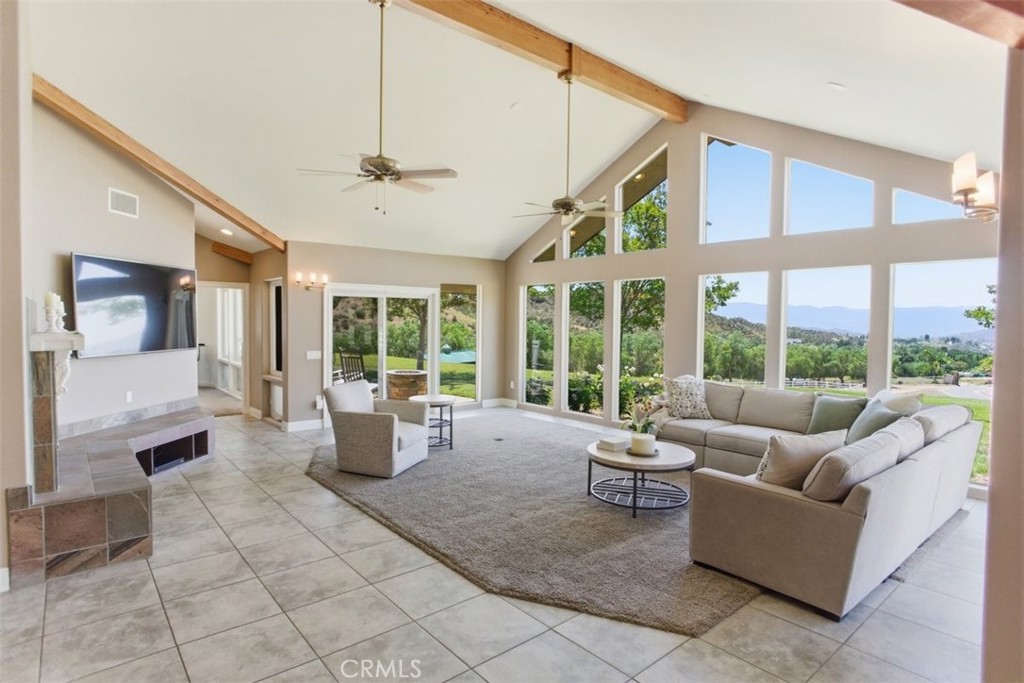 31233 Romero Canyon Road Castaic, CA 91384 - Photo 8 of 38 a living room with furniture and large windows