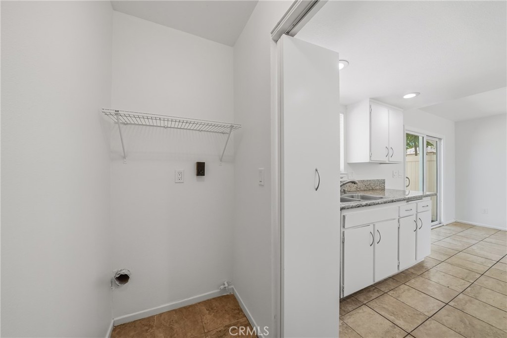 3469 Columbia Avenue Riverside, CA 92501 - Photo 13 of 31 a kitchen with cabinets and window