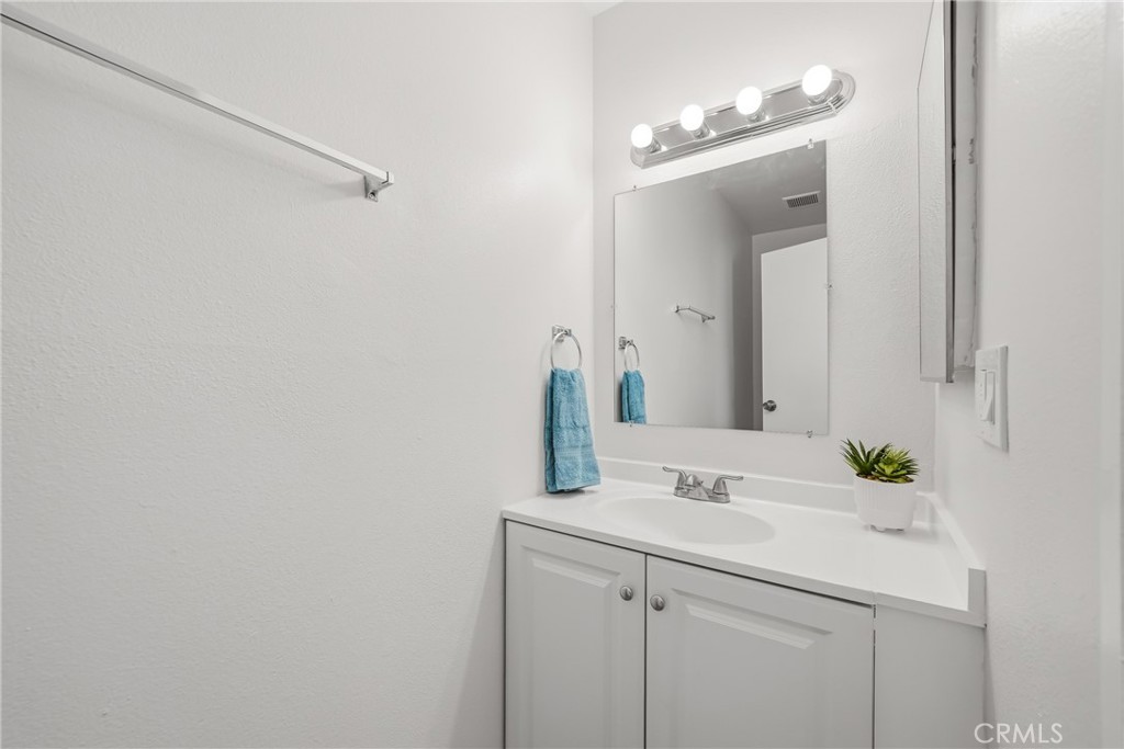 3469 Columbia Avenue Riverside, CA 92501 - Photo 13 of 30 a bathroom with a sink and a mirror