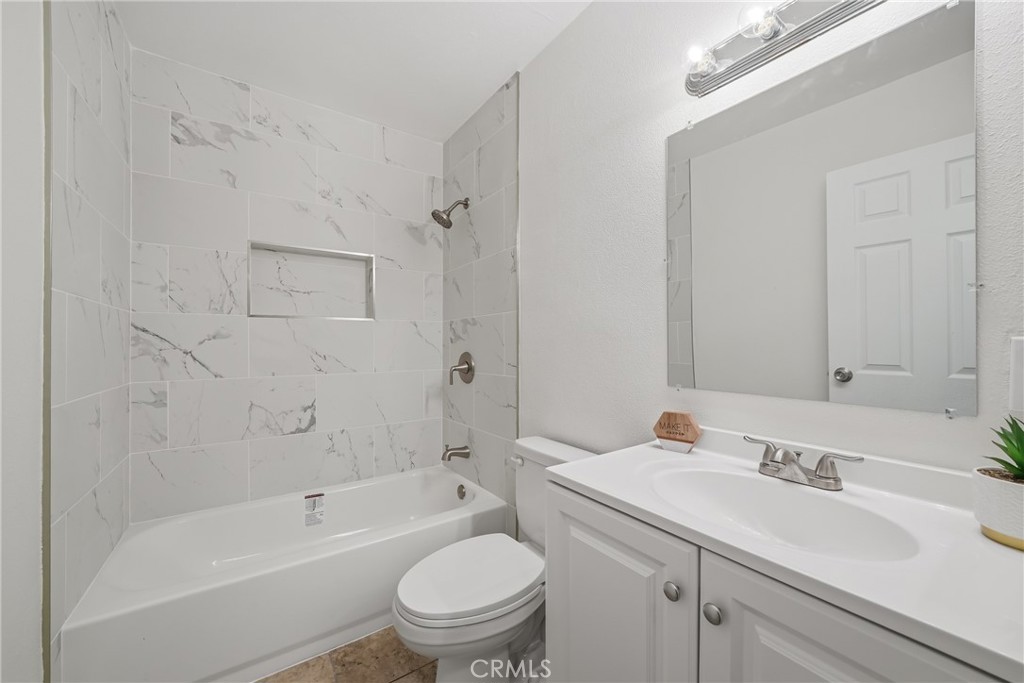 3469 Columbia Avenue Riverside, CA 92501 - Photo 15 of 30 a bathroom with a sink toilet and shower