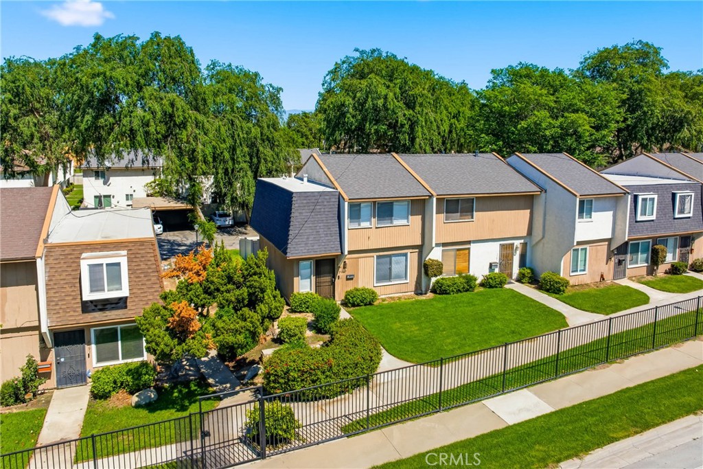 3469 Columbia Avenue Riverside, CA 92501 - Photo 26 of 30 a view of a white house with a yard and plants