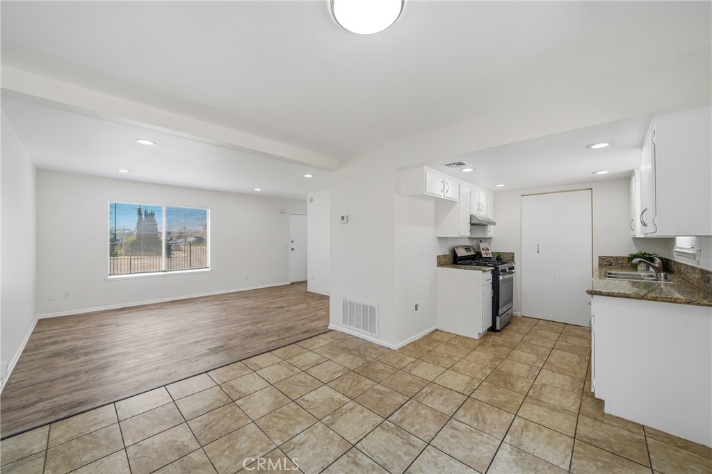 3469 Columbia Avenue Riverside, CA 92501 - Photo 7 of 30 a view of a kitchen with a sink cabinets and a window
