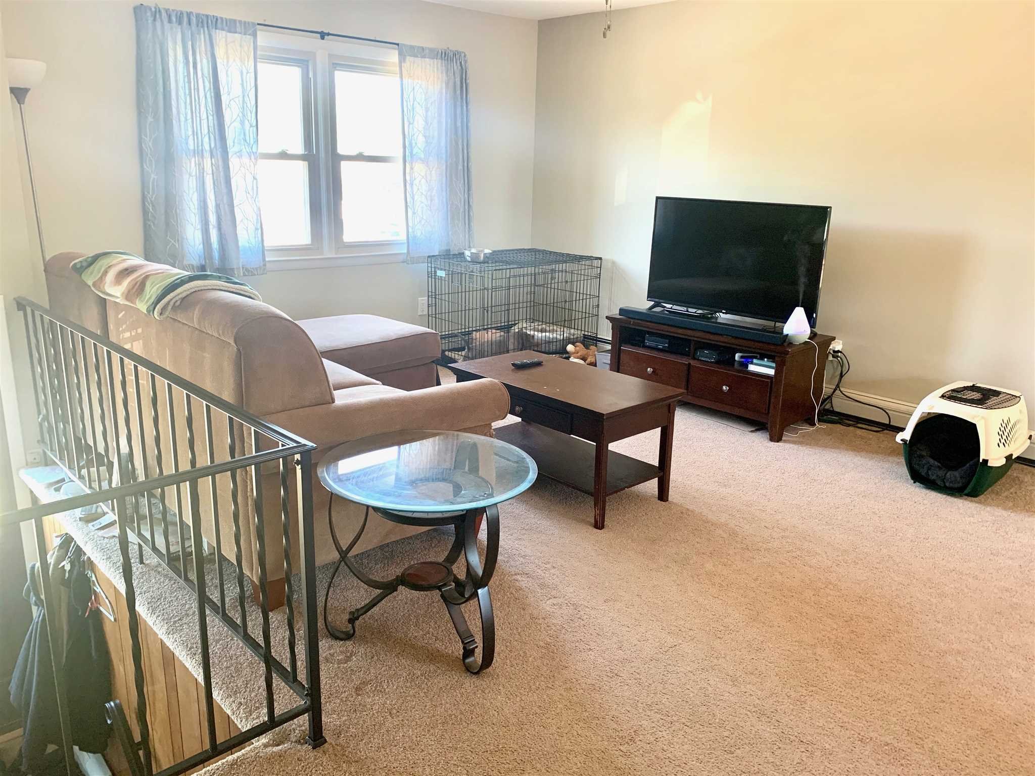 6 Academy Street Beacon, NY 12508 - Photo 12 of 22 a living room with furniture and a flat screen tv