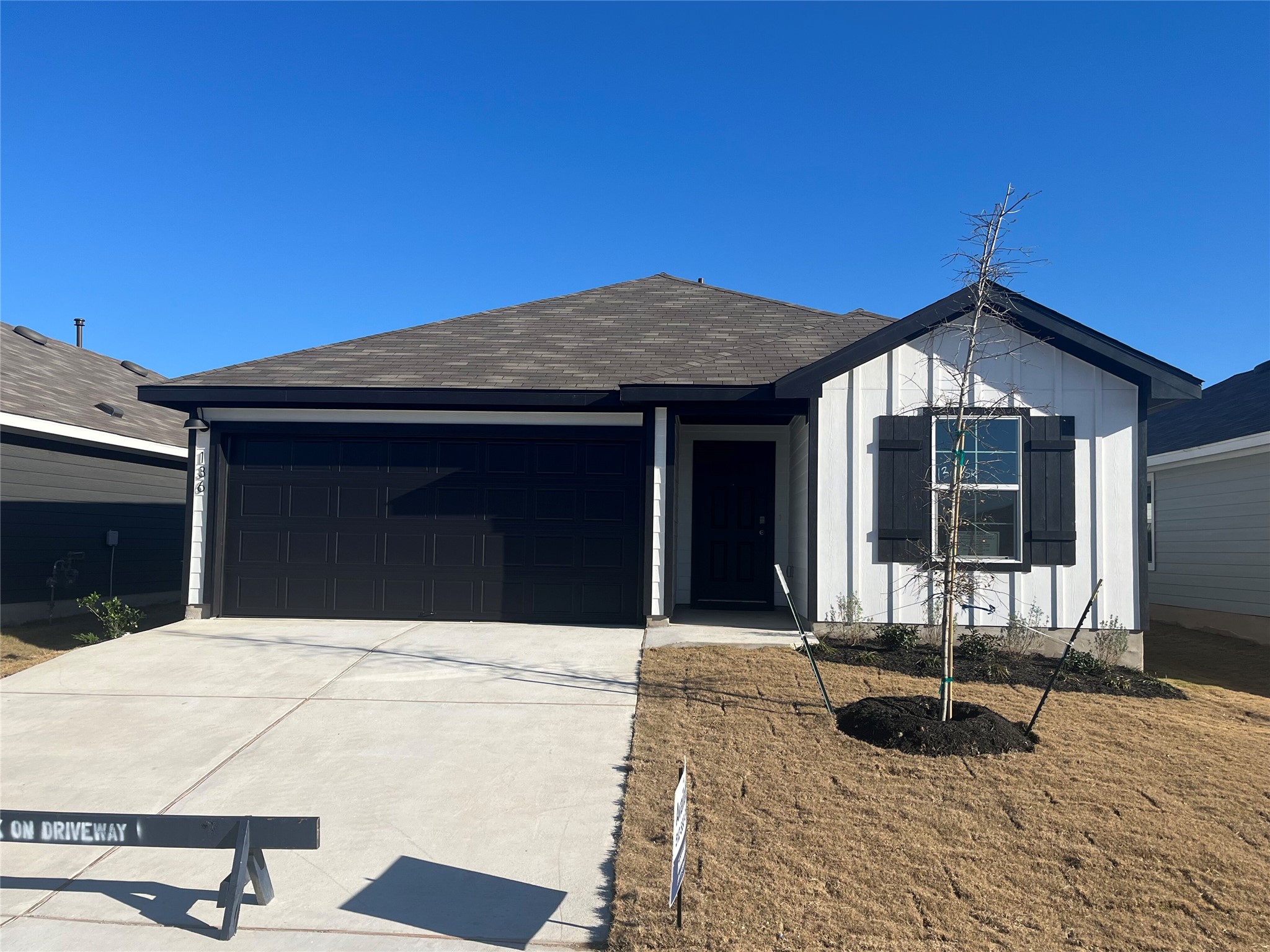 861 Arnold Loop Kyle, TX 78640 - Photo 1 of 1 a front view of a house with yard