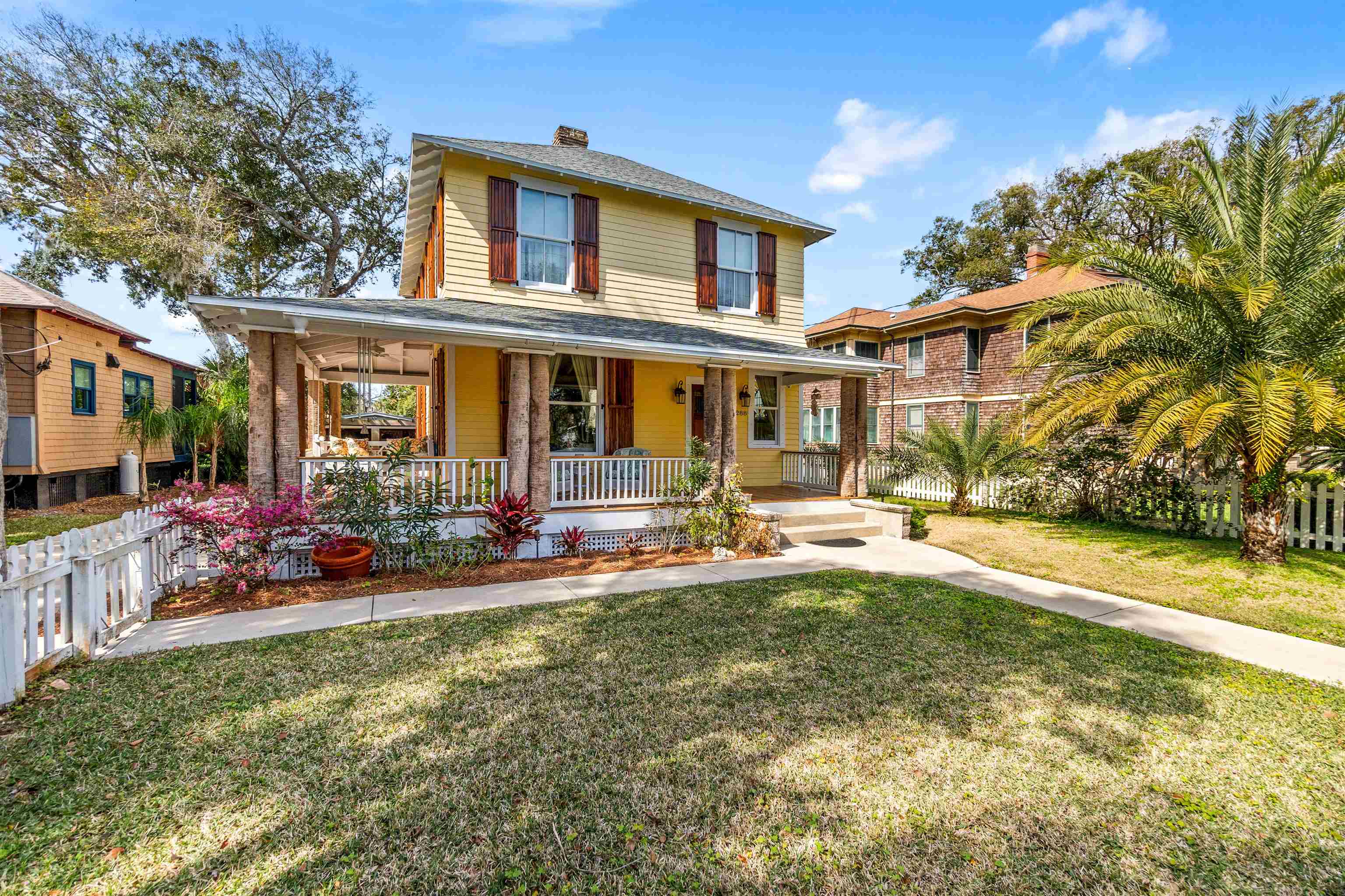 a view of a house with swimming pool and sitting area