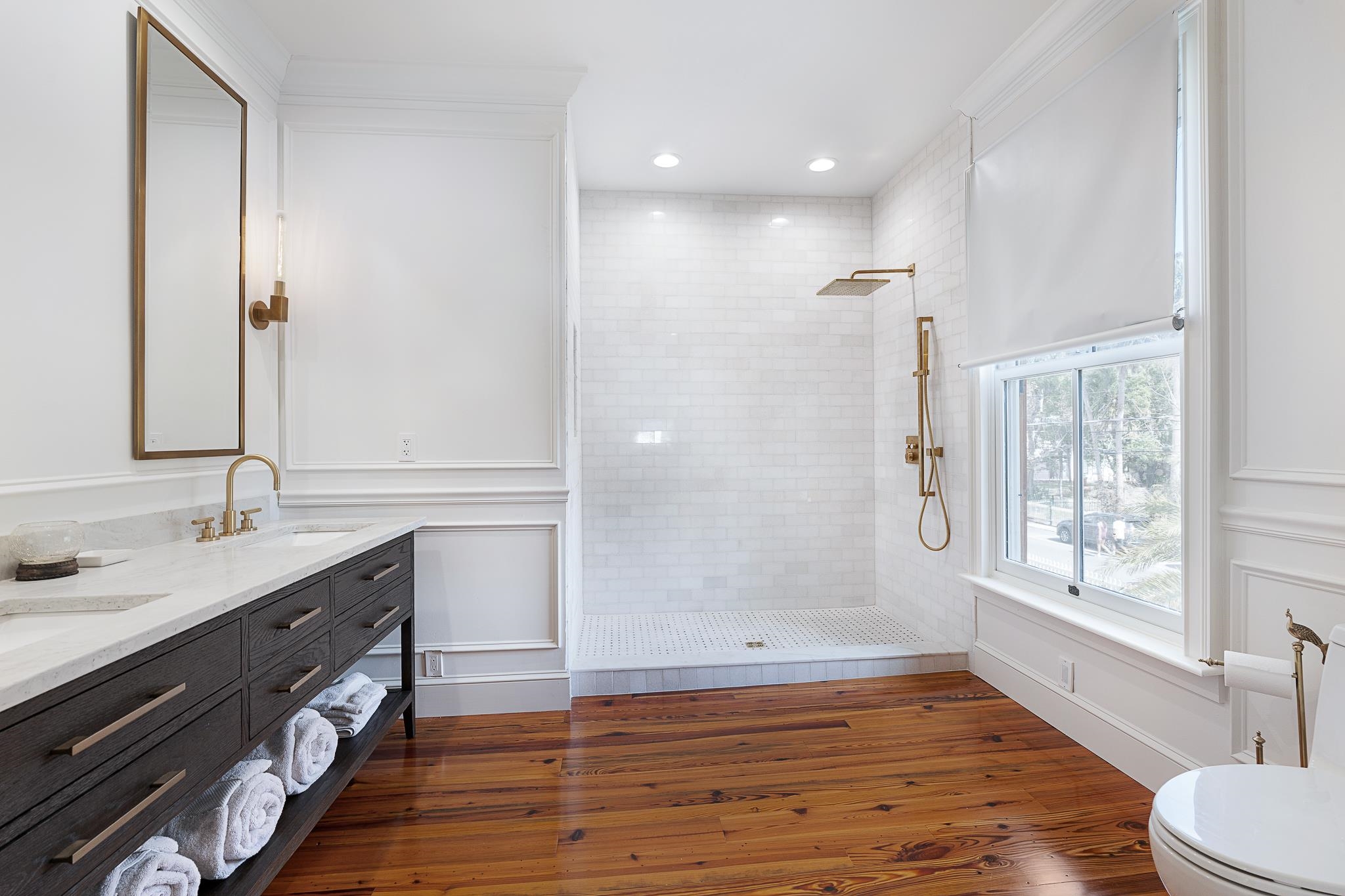 288 St George Street St. Augustine, FL 32084 - Photo 29 of 65 a bathroom with a double vanity sink mirror and shower