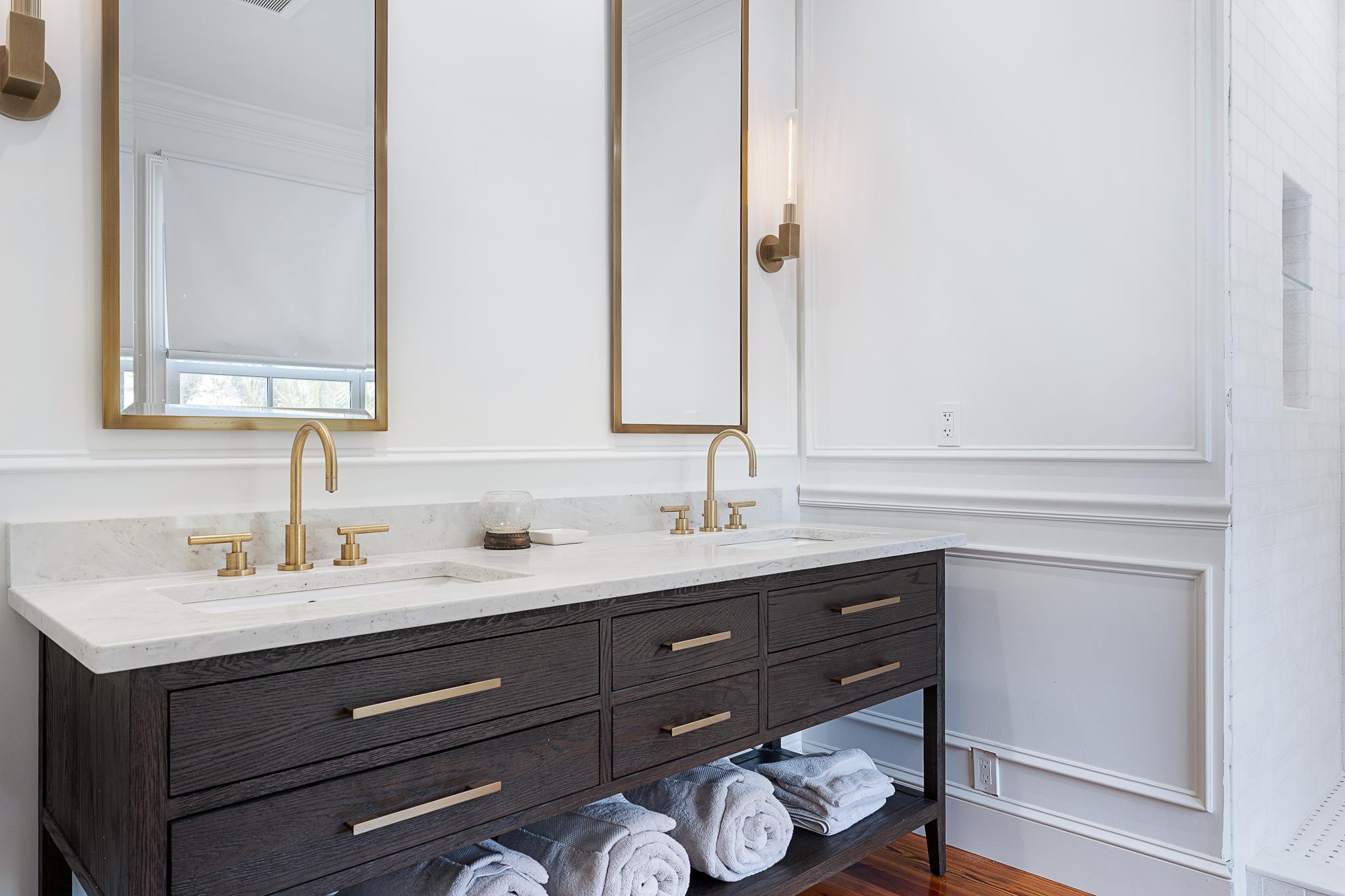 288 St George Street St. Augustine, FL 32084 - Photo 31 of 65 a bathroom with a sink and a mirror