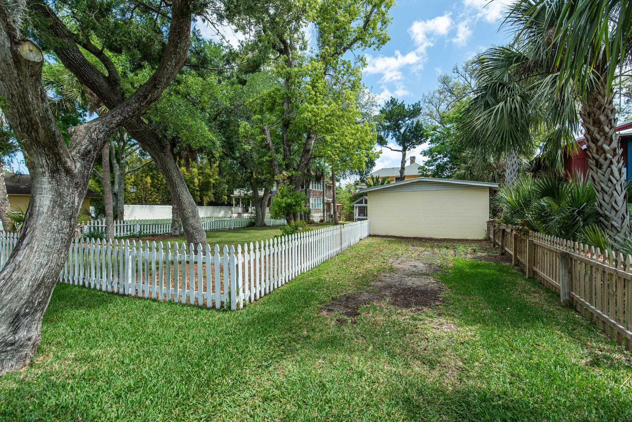 288 St George Street St. Augustine, FL 32084 - Photo 57 of 65 a view of a house with a yard and a large tree
