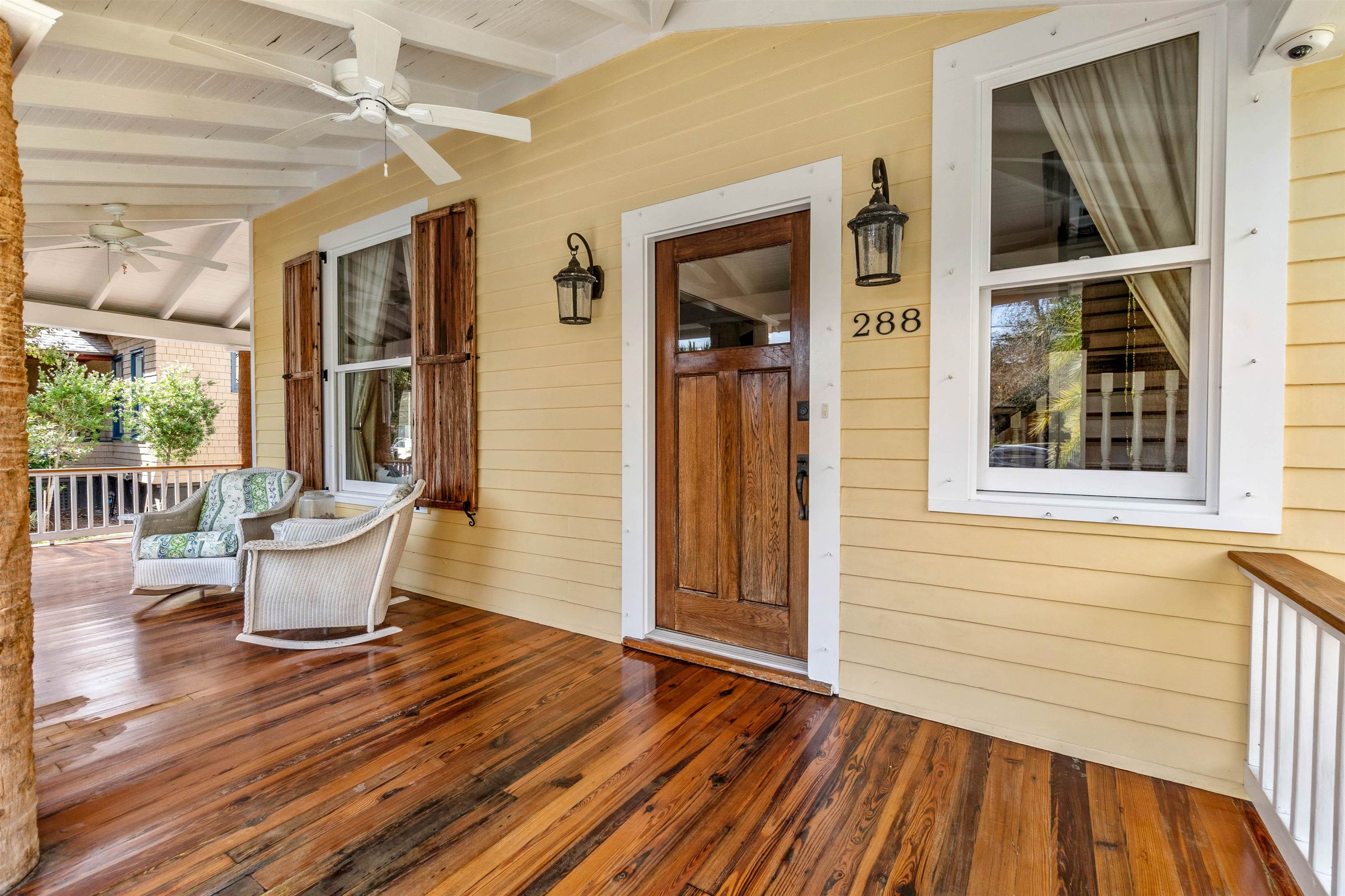 288 St George Street St. Augustine, FL 32084 - Photo 6 of 65 a view of a patio with table and chairs and wooden floor