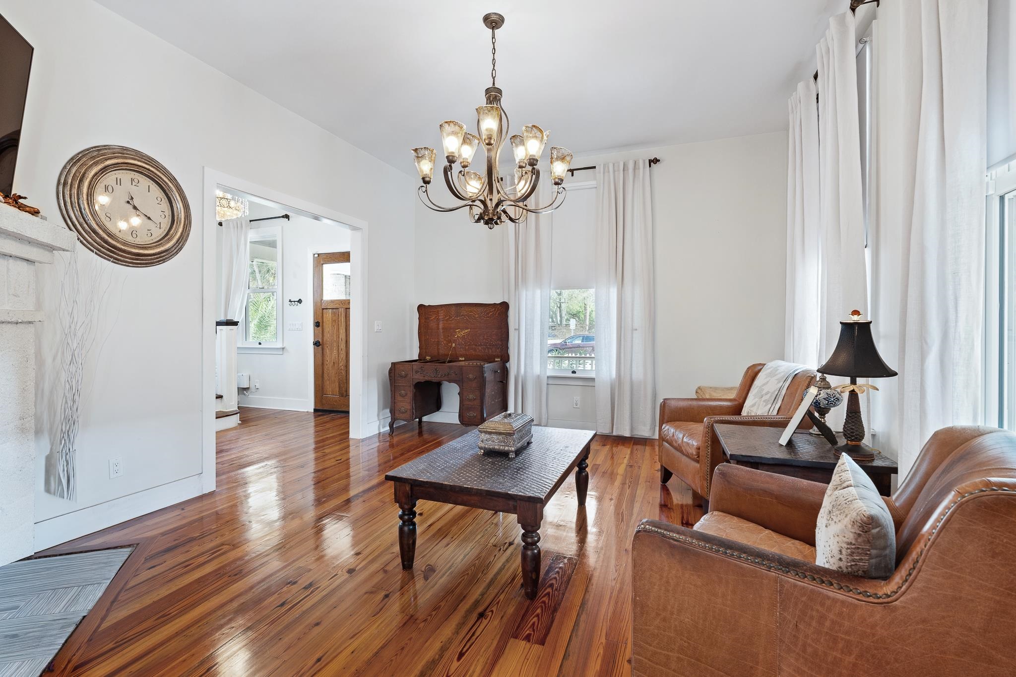 288 St George Street St. Augustine, FL 32084 - Photo 9 of 65 a living room with furniture a clock and a window