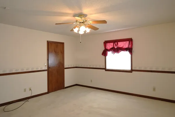 a bathroom with a toilet a sink and shower