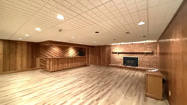 a fireplace with a wooden floor
