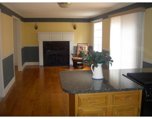 5 Gerrish Road Rochester, MA 02770 - Photo 7 of 10 a kitchen with a sink a counter top space and a fireplace