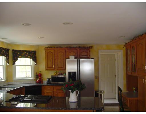 5 Gerrish Road Rochester, MA 02770 - Photo 9 of 10 a kitchen with stainless steel appliances a refrigerator and a sink