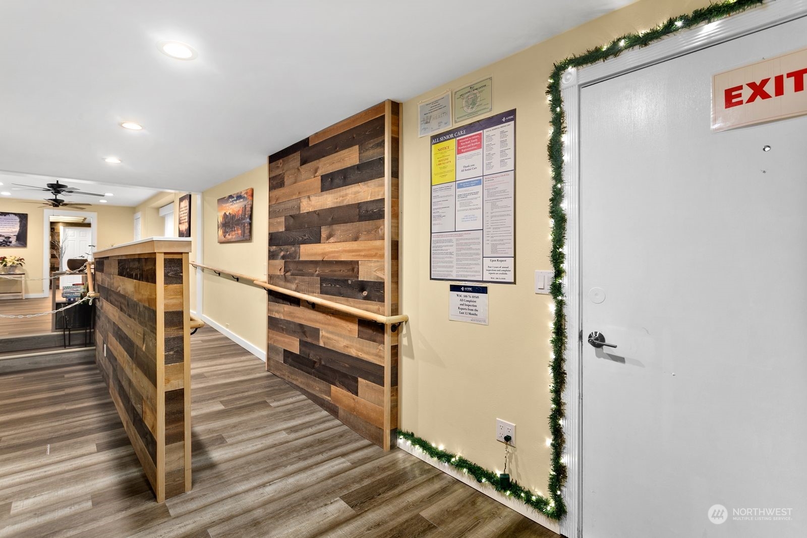 1402 North 28th Street Renton, WA 98056 - Photo 4 of 29 a view of a hallway with wooden floor and staircase