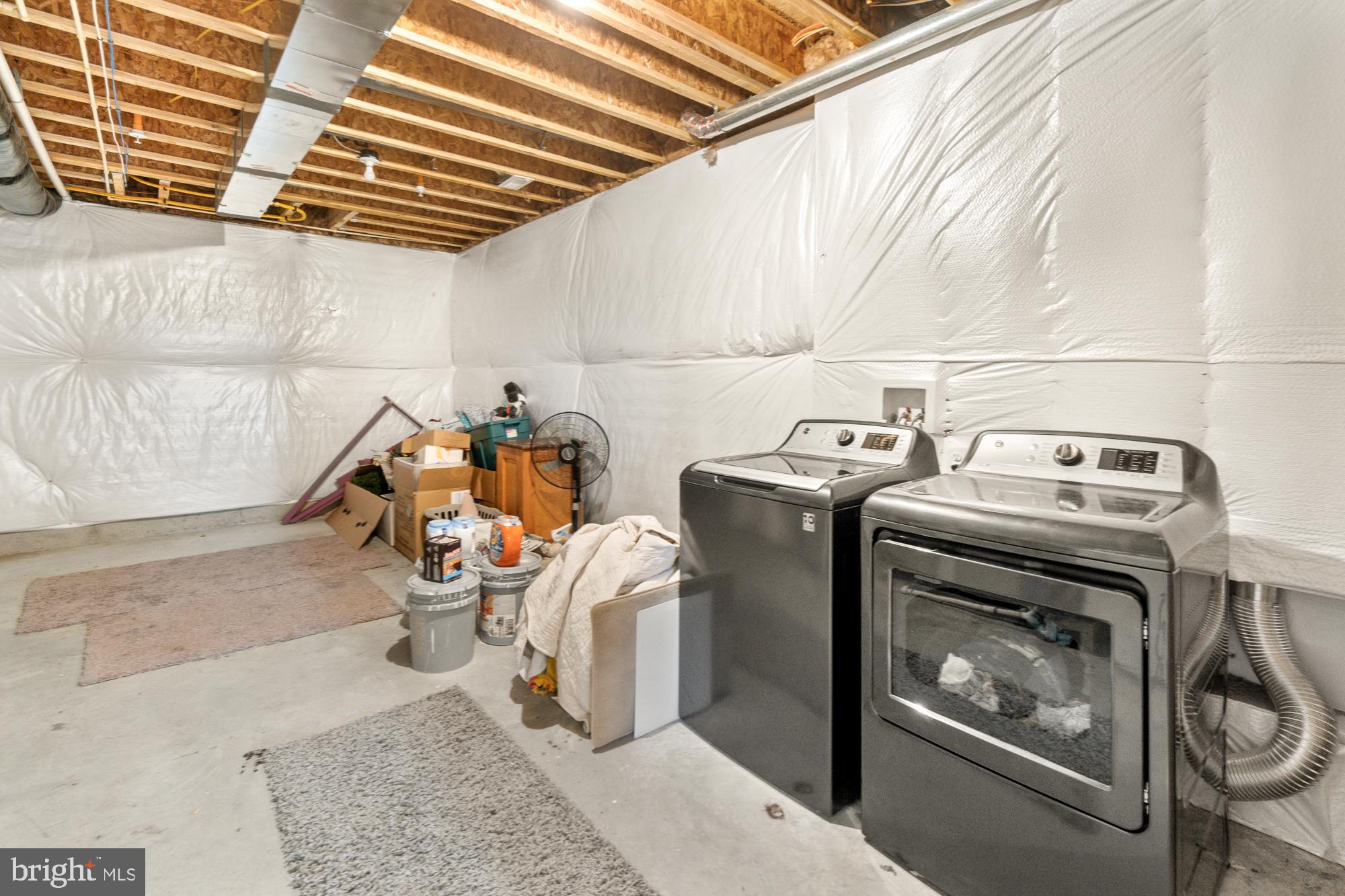 7020 Fox Chase Road New Market, MD 21774 - Photo 38 of 58 Laundry in basement with lots of extra storage.