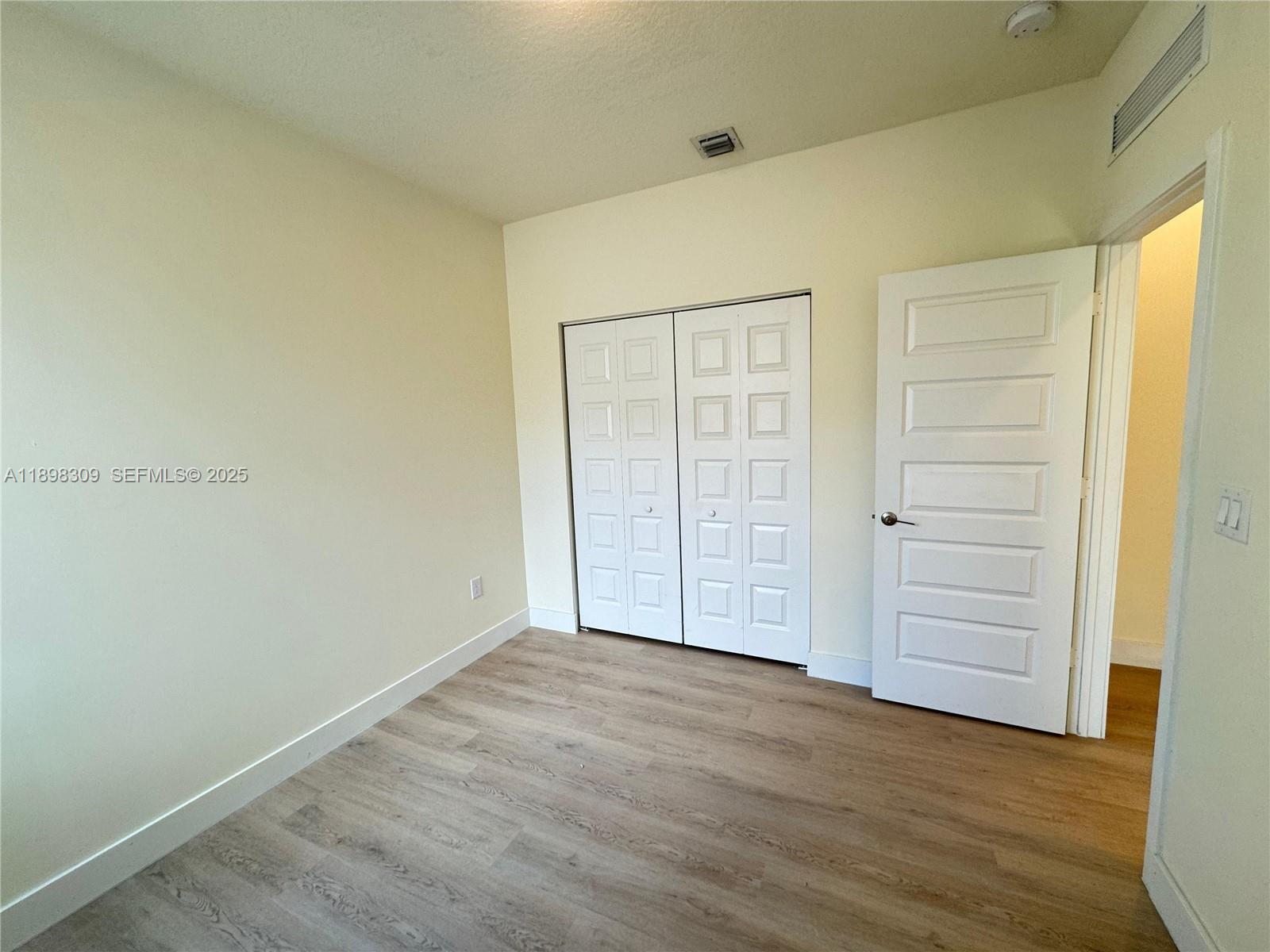 4802 Northwest 83rd Path Doral, FL 33166 - Photo 14 of 25 an empty room with closet