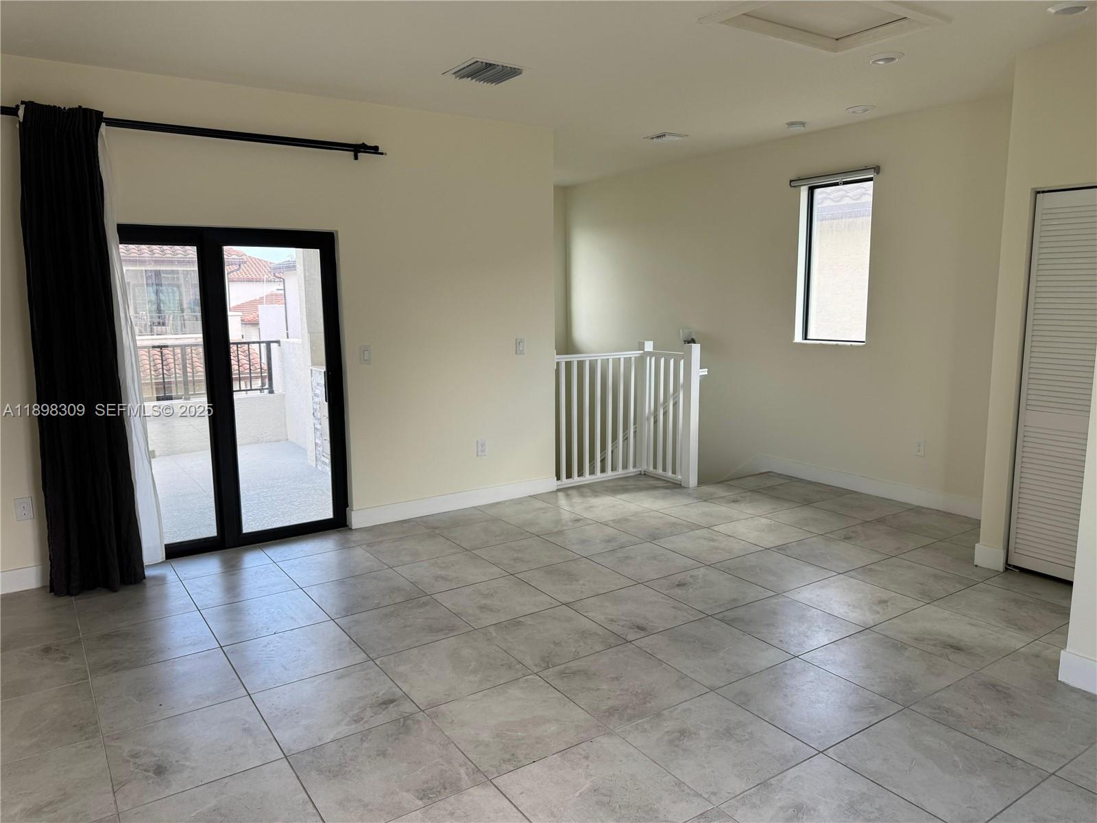 4802 Northwest 83rd Path Doral, FL 33166 - Photo 21 of 25 a view of a hallway with entryway door