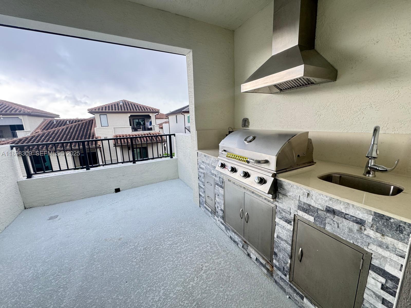 4802 Northwest 83rd Path Doral, FL 33166 - Photo 24 of 25 a kitchen with stove and cabinets
