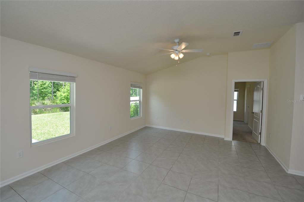 80 Oakleaf Way Palm Coast, FL 32137 - Photo 12 of 33 an empty room with windows and closet