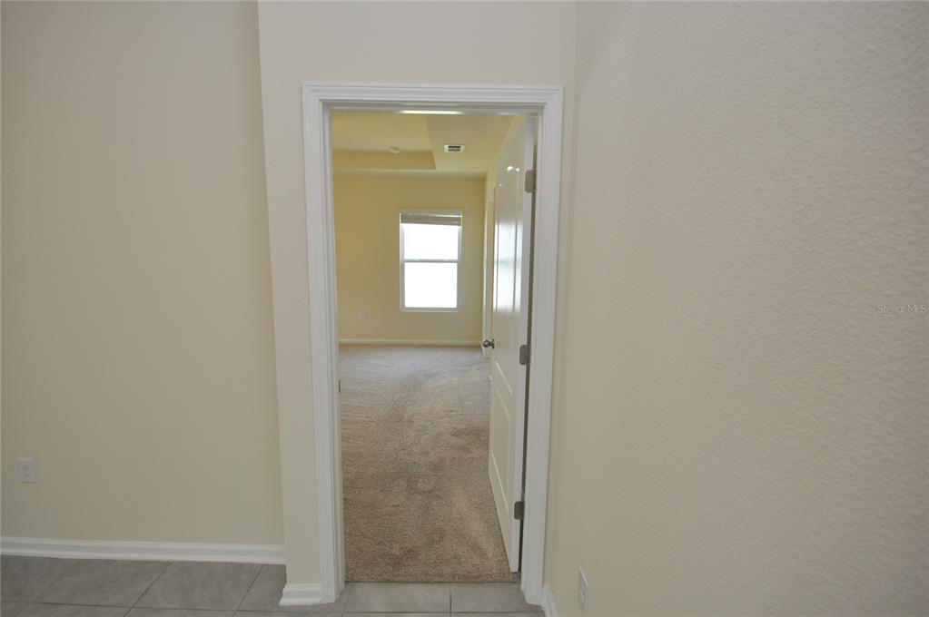 80 Oakleaf Way Palm Coast, FL 32137 - Photo 15 of 33 a bathroom with a glass door shower and a sink