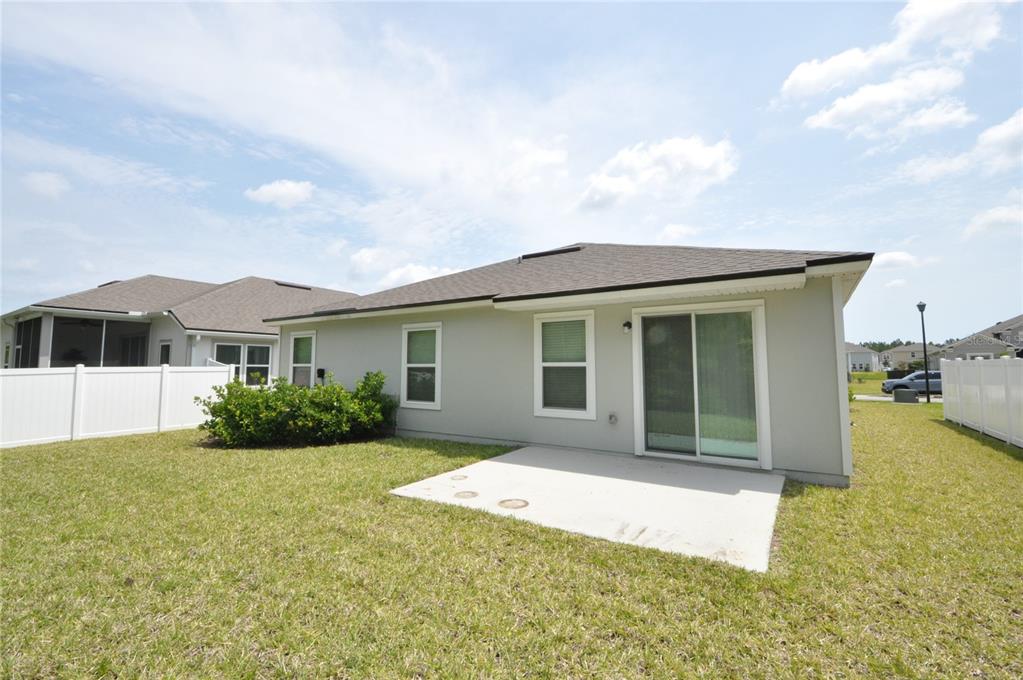 80 Oakleaf Way Palm Coast, FL 32137 - Photo 2 of 33 a front view of a house with garden