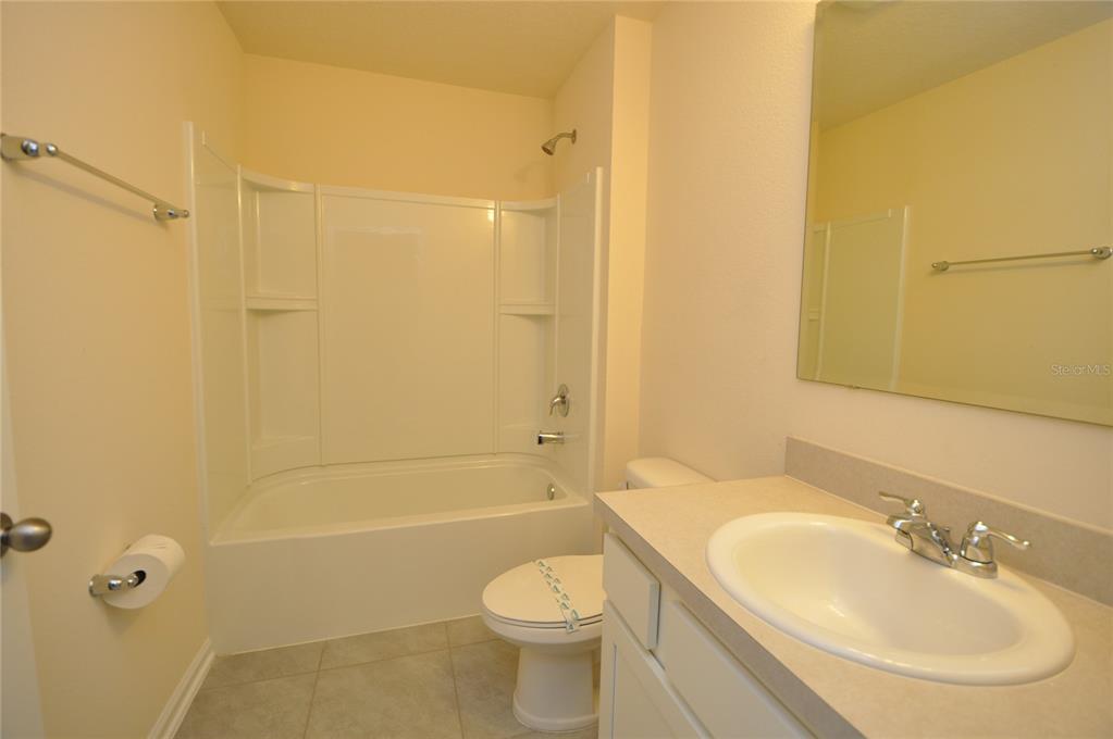80 Oakleaf Way Palm Coast, FL 32137 - Photo 28 of 33 a bathroom with a sink toilet and shower