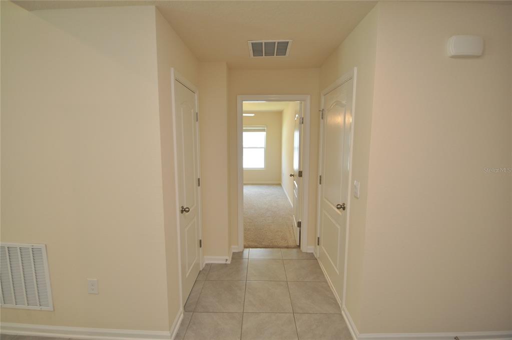 80 Oakleaf Way Palm Coast, FL 32137 - Photo 3 of 33 a view of a hallway with wooden floor
