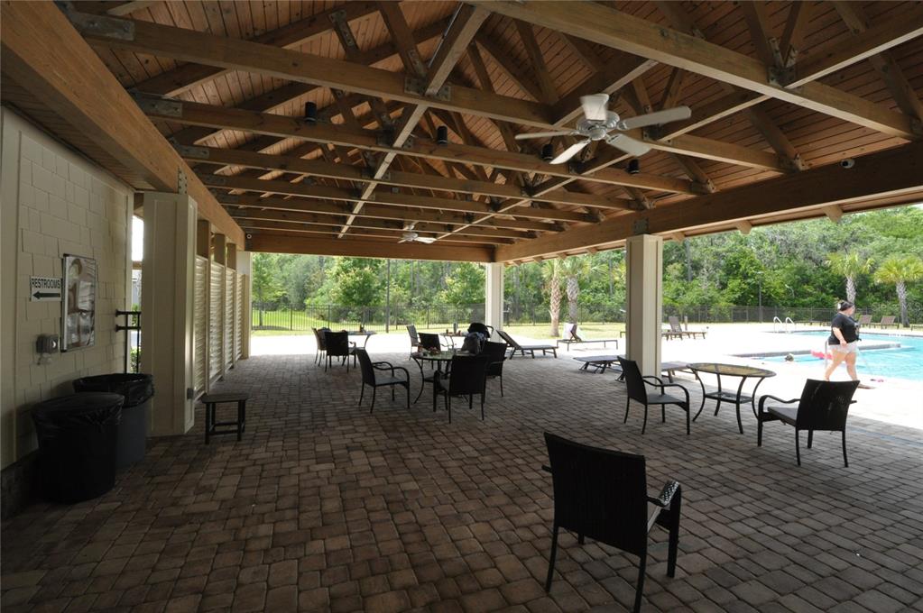 80 Oakleaf Way Palm Coast, FL 32137 - Photo 33 of 33 a view of a swimming pool with a table and chairs