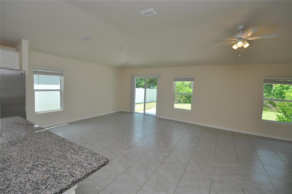 80 Oakleaf Way Palm Coast, FL 32137 - Photo 10 of 33 an empty room with windows