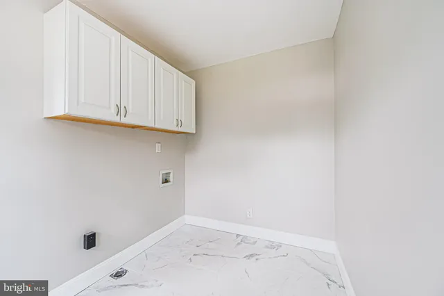 a view of a utility room with marble wall