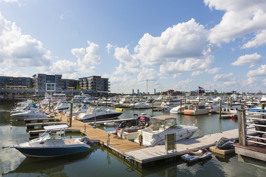 209 Victory Road, Unit 209 Quincy, MA 02171 - Photo 11 of 17 a view of a lake with cars parked