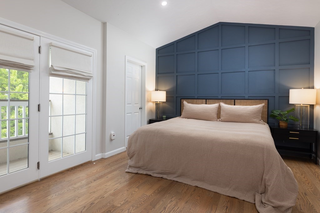 209 Victory Road, Unit 209 Quincy, MA 02171 - Photo 6 of 17 a bedroom with a bed and a window