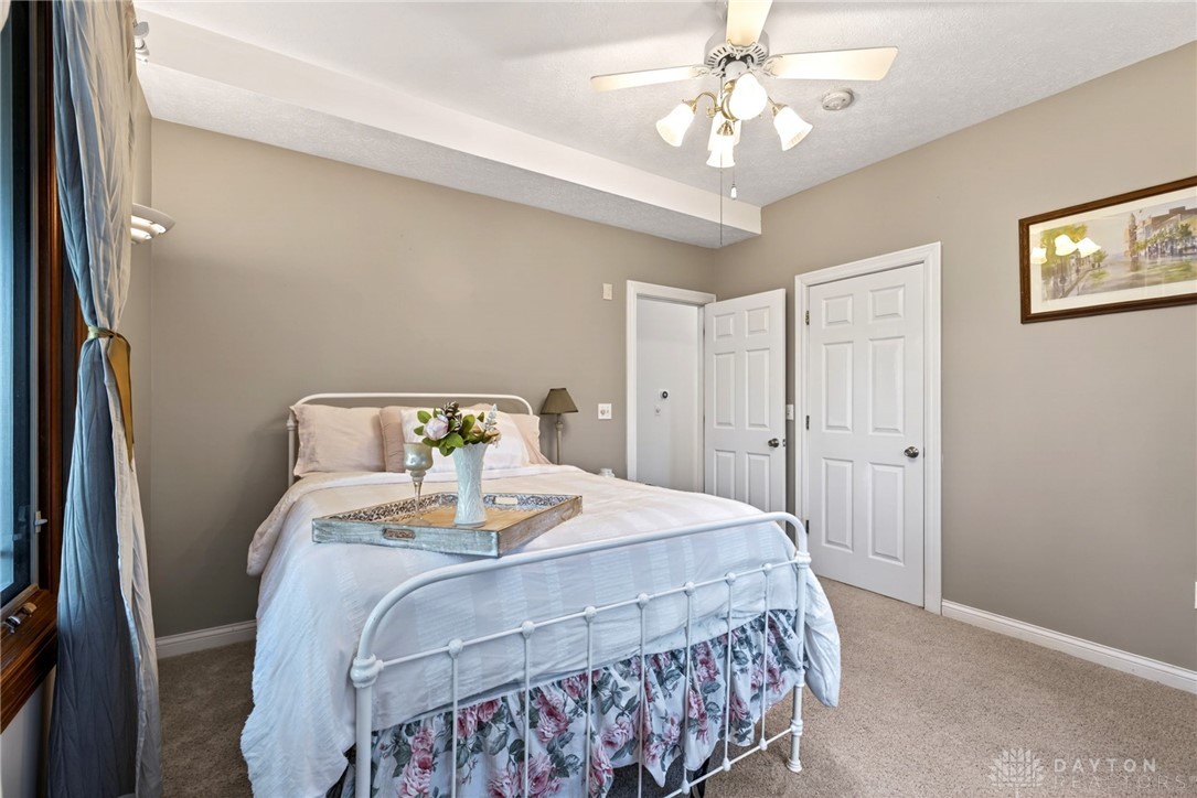 330 South Alpha Bellbrook Road Bellbrook, OH 45305 - Photo 32 of 87 This inviting bedroom features a cozy bed and warm, neutral tones.