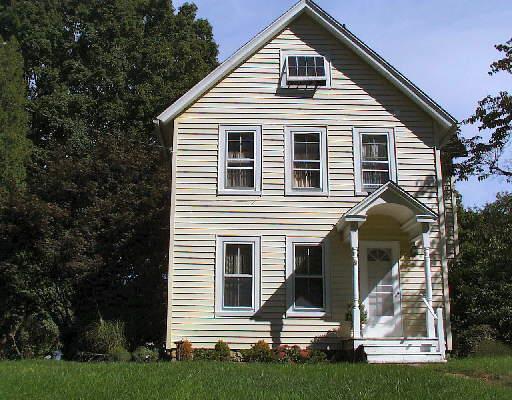 118 Barry Avenue Ridgefield, CT 06877 - Photo 1 of 1 a front view of a house with a yard