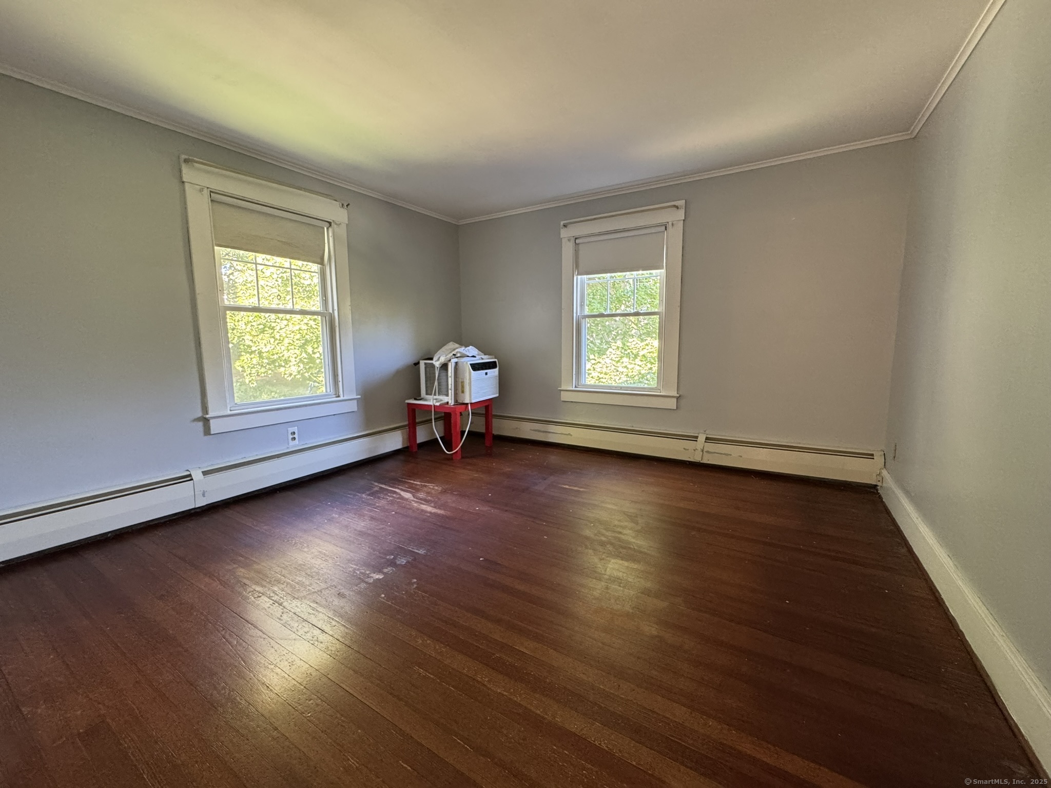 16 Park Place Meriden, CT 06451 - Photo 19 of 30 an empty room with wooden floor and windows
