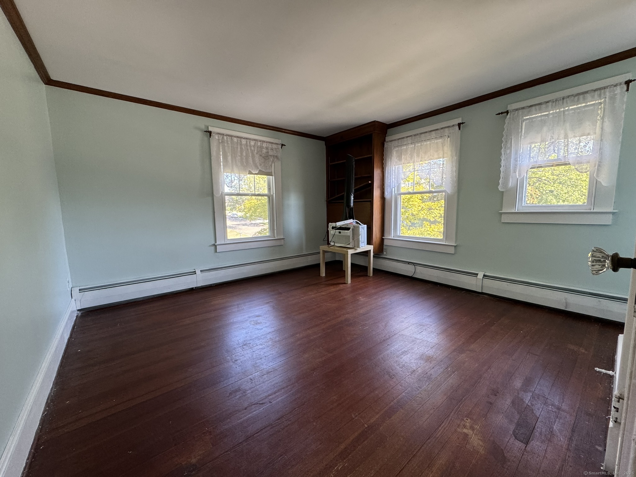 16 Park Place Meriden, CT 06451 - Photo 23 of 30 an empty room with wooden floor and windows