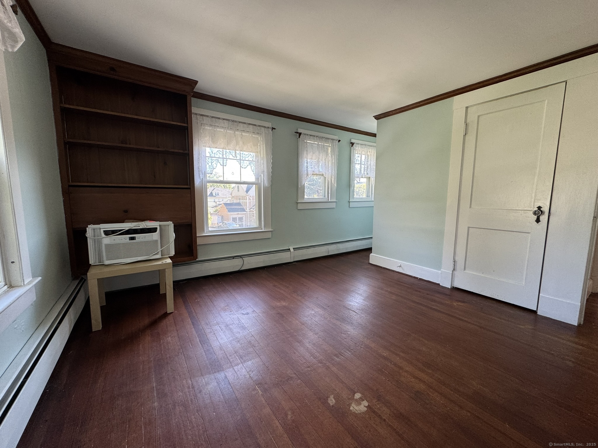 16 Park Place Meriden, CT 06451 - Photo 24 of 30 an empty room with wooden floor and windows