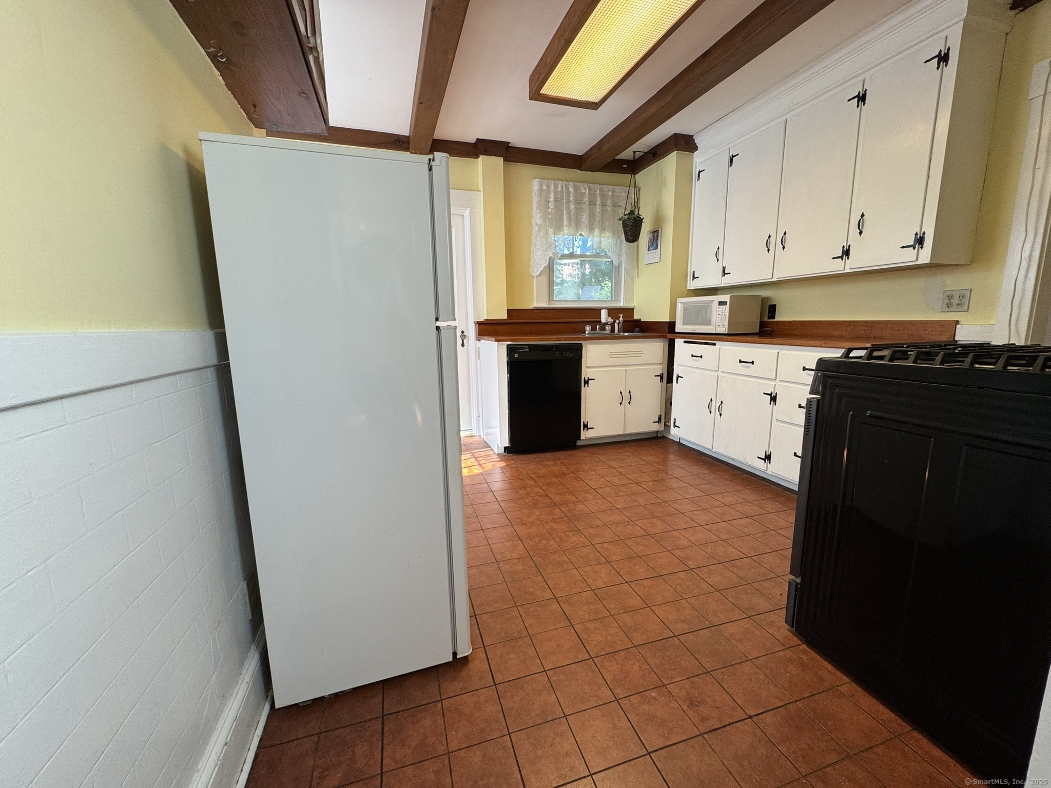 16 Park Place Meriden, CT 06451 - Photo 6 of 30 a kitchen with stainless steel appliances a refrigerator sink and cabinets