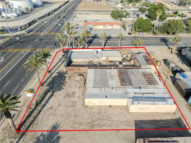 a view of a tennis court with umbrellas