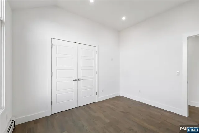 an empty room with wooden floor
