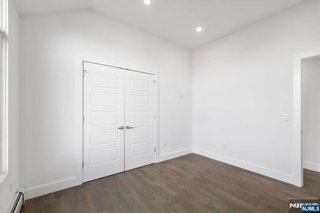 12 Orchard Street, Unit 12 Edgewater, NJ 07020 - Photo 11 of 33 an empty room with wooden floor