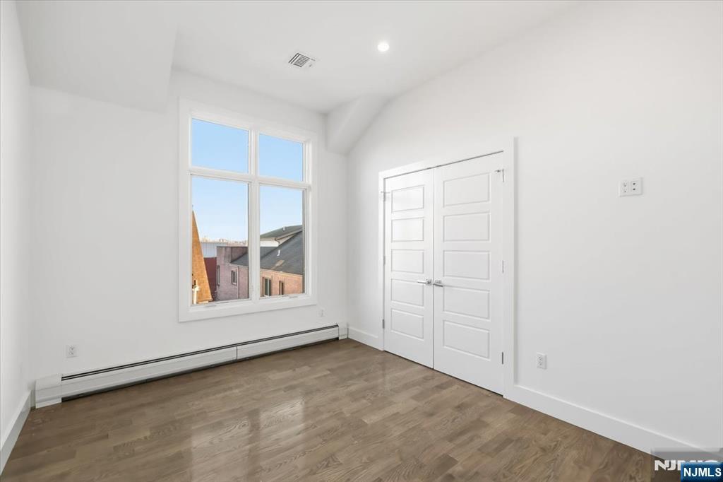 12 Orchard Street, Unit 12 Edgewater, NJ 07020 - Photo 12 of 33 an empty room with a window