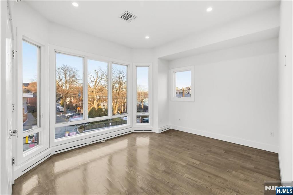 12 Orchard Street, Unit 12 Edgewater, NJ 07020 - Photo 14 of 33 a view of an empty room with a window