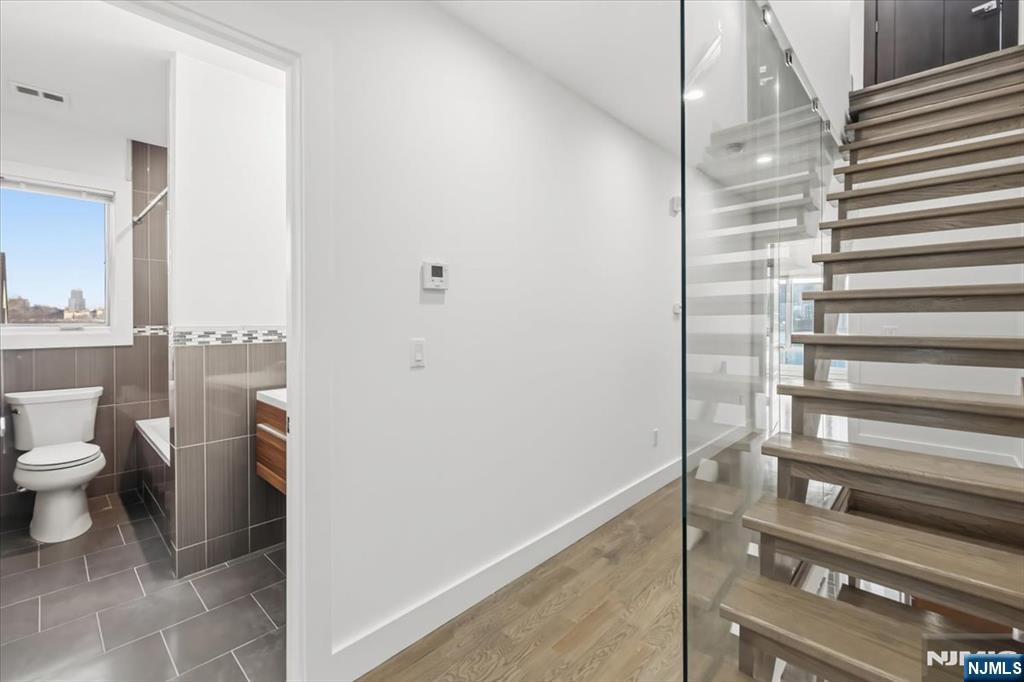 12 Orchard Street, Unit 12 Edgewater, NJ 07020 - Photo 15 of 33 a bathroom with a sink and a toilet